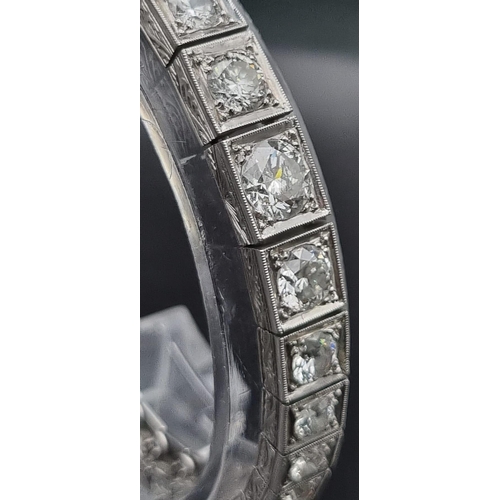 74 - A platinum tennis bracelet with large brilliant cut diamonds. Length: 18 cm, weight: 31.67 g.