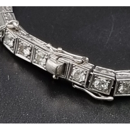 74 - A platinum tennis bracelet with large brilliant cut diamonds. Length: 18 cm, weight: 31.67 g.