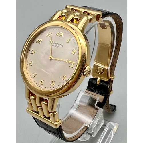 158 - An 18 k yellow gold PATEK PHILIPPE gents watch. 34 mm dial, cream coloured face with gold hands and ... 