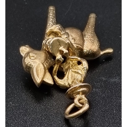 204 - A 9K Yellow Gold Asian Chap Carrying His Load on a Donkey Pendant or Charm. 3cm. 4.12g.