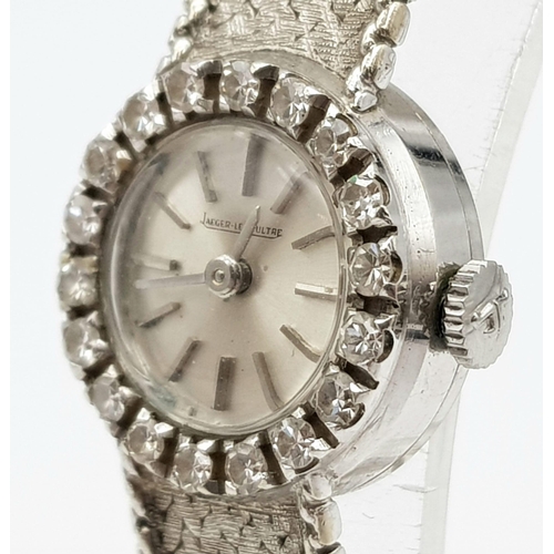 239 - An 18 K white gold JAEGER LE COULTRE ladies watch. 17 mm dial, bezel with brilliant cut diamonds. ma... 