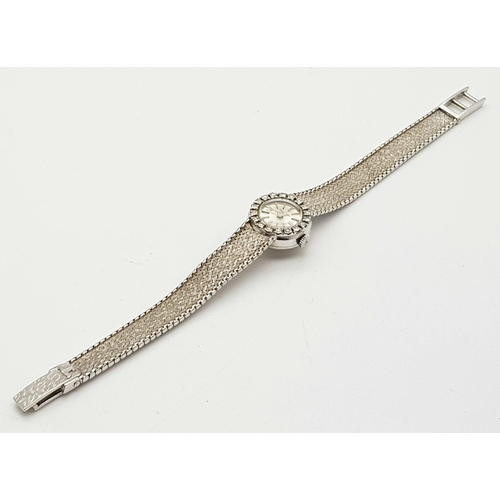 239 - An 18 K white gold JAEGER LE COULTRE ladies watch. 17 mm dial, bezel with brilliant cut diamonds. ma... 