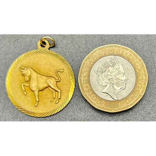 625 - A 9K Yellow Gold Taurus Bull Pendant. 22mm diameter.
3.84g.