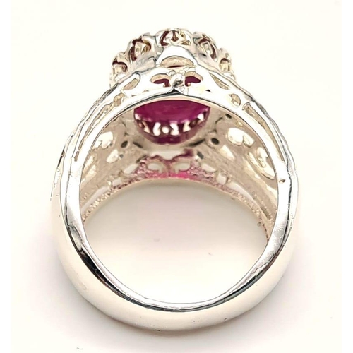 648 - 7.35cts Oval Cut Ruby Gemstone Ring in Vintage style, 925 Silver. 8.69 grams. Size: O 1/2