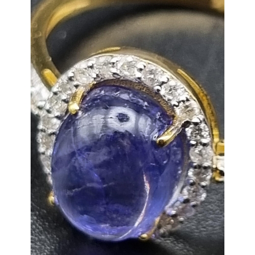 656 - 2.70cts Tanzanite Gemstone ring with .28cents diamonds in 14kt solid gold. 2.80 grams. Size: N 1/2. ... 