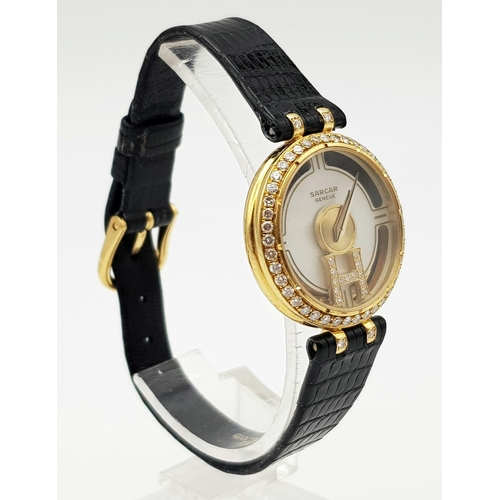 71 - An 18 K yellow gold SARCAR MAGIC MOON ladies watch. 25 mm dial, MOP face with windows to see part of... 