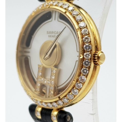 71 - An 18 K yellow gold SARCAR MAGIC MOON ladies watch. 25 mm dial, MOP face with windows to see part of... 