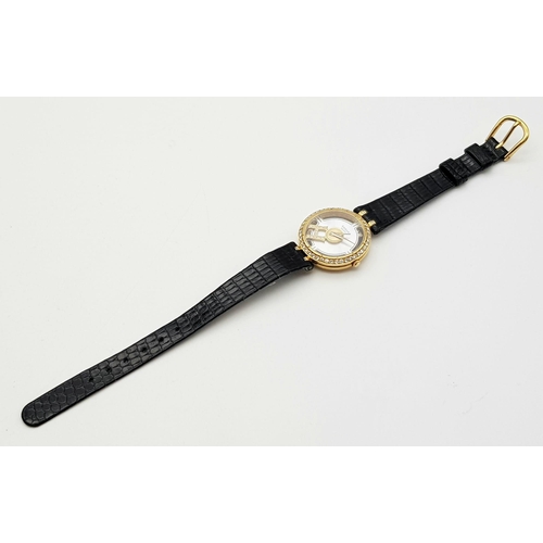 71 - An 18 K yellow gold SARCAR MAGIC MOON ladies watch. 25 mm dial, MOP face with windows to see part of... 