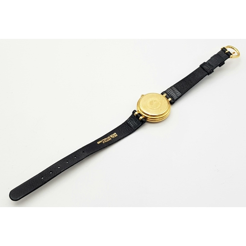 71 - An 18 K yellow gold SARCAR MAGIC MOON ladies watch. 25 mm dial, MOP face with windows to see part of... 