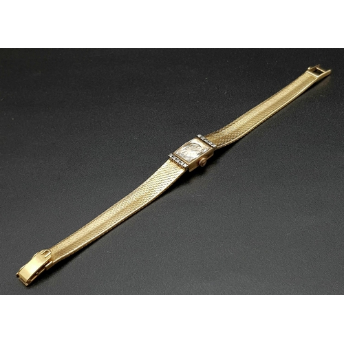 184 - A vintage 18 K yellow gold UNIVERSAL ladies watch. Rectangular dial (20 x 12 mm) with diamonds on th... 