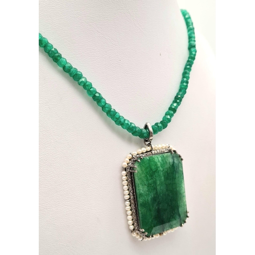 669 - 105cts Emerald Gemstone Pendant with halo of 1ct of Diamonds in pave setting and 8cts pearls, comes ... 