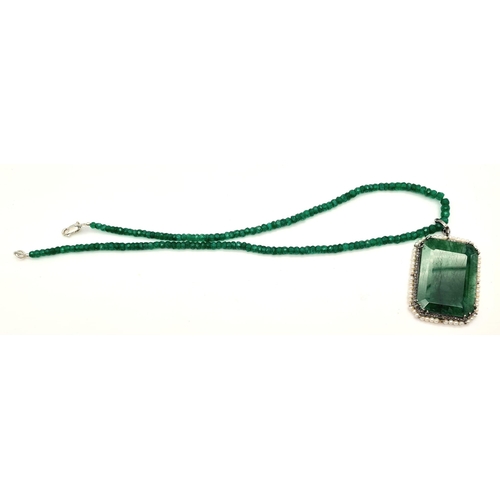 669 - 105cts Emerald Gemstone Pendant with halo of 1ct of Diamonds in pave setting and 8cts pearls, comes ... 