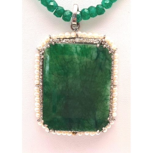 669 - 105cts Emerald Gemstone Pendant with halo of 1ct of Diamonds in pave setting and 8cts pearls, comes ... 