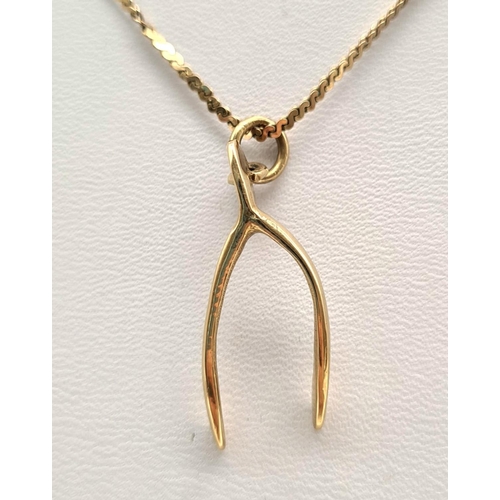 472 - A 9K Yellow Gold Wishbone Pendant on a 9K Yellow Gold Necklace.  3.28g total weight/