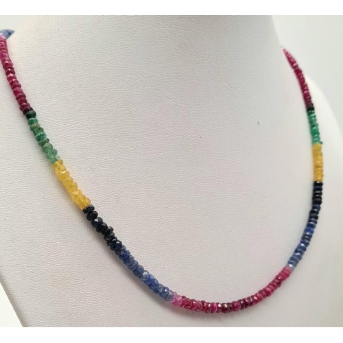 645 - An Emerald, Sapphire and Ruby Bead Necklace. 40cm.