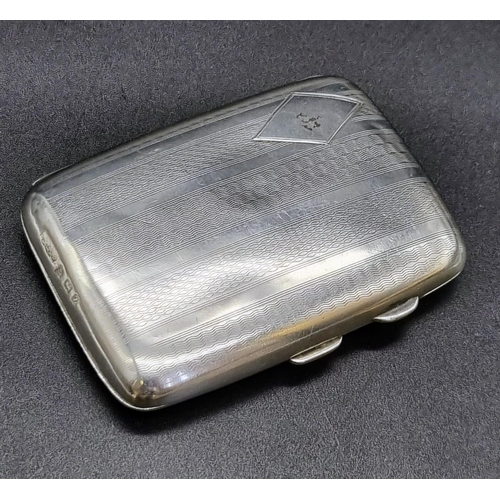 633 - An Antique Silver Cigarette Case with Tortoiseshell Interior. Hallmarks for Birmingham 1924. 8 x 6cm... 