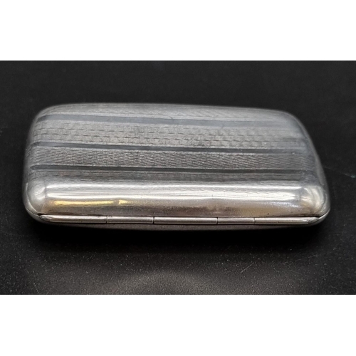 633 - An Antique Silver Cigarette Case with Tortoiseshell Interior. Hallmarks for Birmingham 1924. 8 x 6cm... 