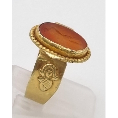 264 - An Ancient Greek Possibly Roman Intaglio Carnelian Agate Ring. Size P. 3.4g total weight.