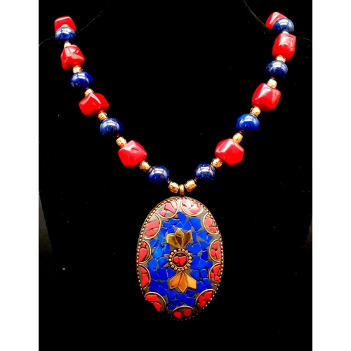 303 - A Nepalese, ethnic, necklace and earrings set with lapis lazuli and red coral. Necklace length: 48 c... 