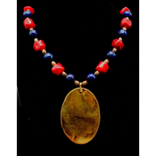 303 - A Nepalese, ethnic, necklace and earrings set with lapis lazuli and red coral. Necklace length: 48 c... 