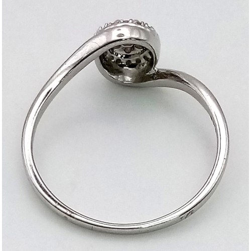 491 - A 9K White Gold Diamond Crossover Cluster Ring. Size P. 
1.94g total weight.