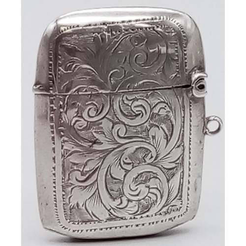 304 - An Antique Silver Vesta Case. Hallmarks for Birmingham.
3.5 x 4.5cm.