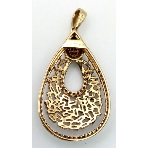 306 - 9K YELLOW GOLD DIAMOND FANCY PENDANT. 3.4G. 1CT APPROX