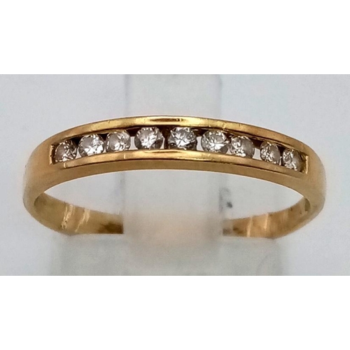 307 - 14K YELLOW GOLD DIAMOND 1/2 ETERNITY RING. 1.5G.  SIZE M 0.18CT.