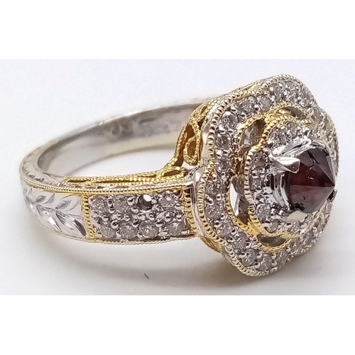 174 - An Incredible 18k Yellow and White Gold Diamond ring. Central red diamond surrounded by a double hal... 