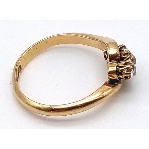 734 - An 18K Yellow Gold Diamond Three-Stone Crossover Ring. Size K. 2.7g total weight.