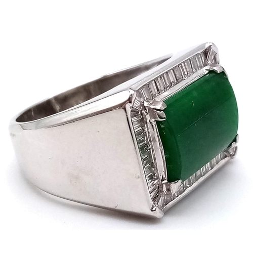 554 - An 18K White Gold Jade and Diamond Ring. Rectangular jade central stone with a diamond surround. Siz... 