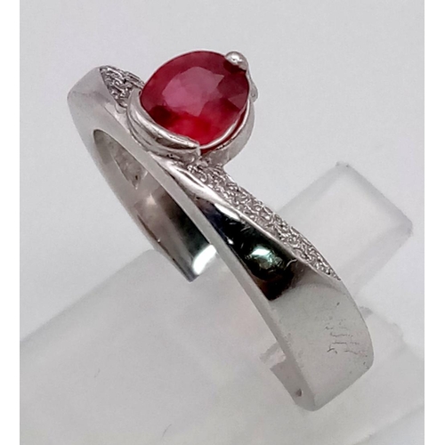 575 - An 18K White Gold Diamond and Burmese Ruby Double Band. Ring 1 - Size 0, with a low swirl of 28 smal... 