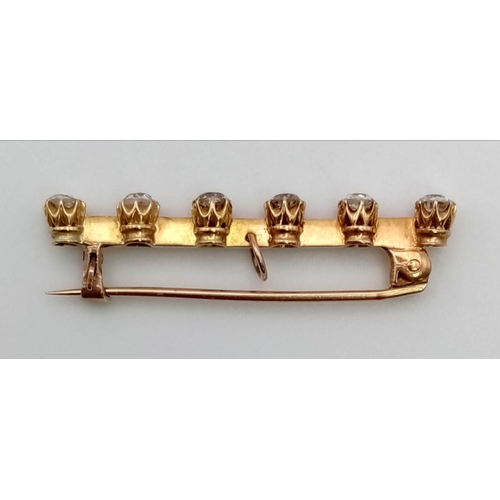 692 - An Antique 15K Gold Bar Brooch with Six Diamonds. 
1.5ct. 2.53g total weight.