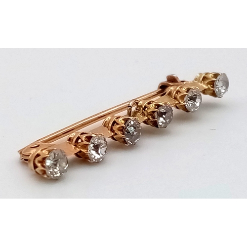 692 - An Antique 15K Gold Bar Brooch with Six Diamonds. 
1.5ct. 2.53g total weight.