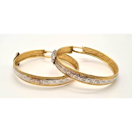 151 - A Pair of 14K Yellow and White Gold Geometric Decorative Hoop Earrings. Lever back clasp. 6.6g total... 