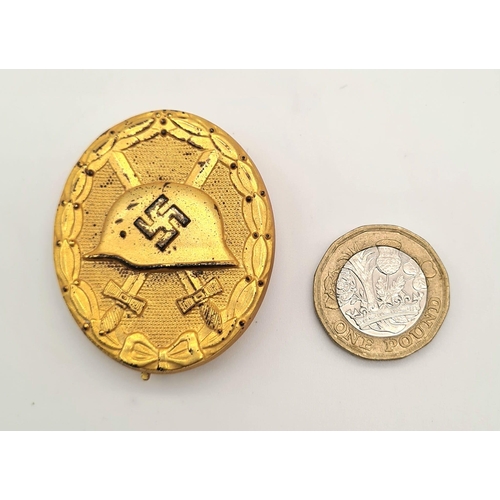 252 - 3rd Reich Gold Grade Wound Badge. Stamped with the LDO no 30 for the maker Hauptmüzamt. These
were a... 