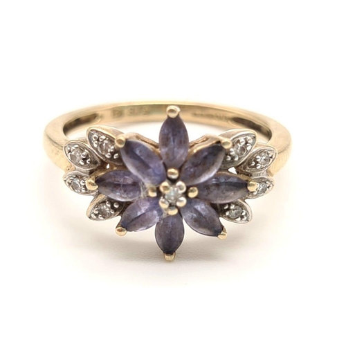 264 - 9K YELLOW GOLD DIAMOND & IOLITE CLUSTER RING. 2.6G. SIZE L