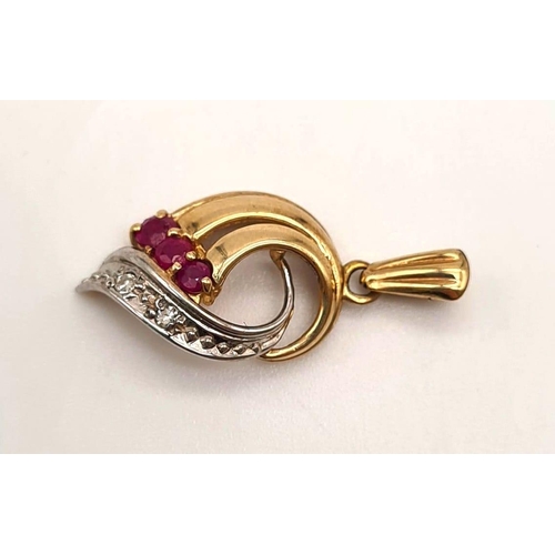 528 - 9K YELLOW GOLD DIAMOND & RUBY PENDANT. 1.3G