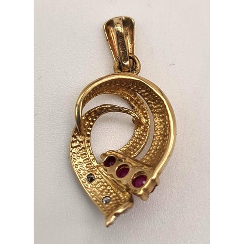 528 - 9K YELLOW GOLD DIAMOND & RUBY PENDANT. 1.3G