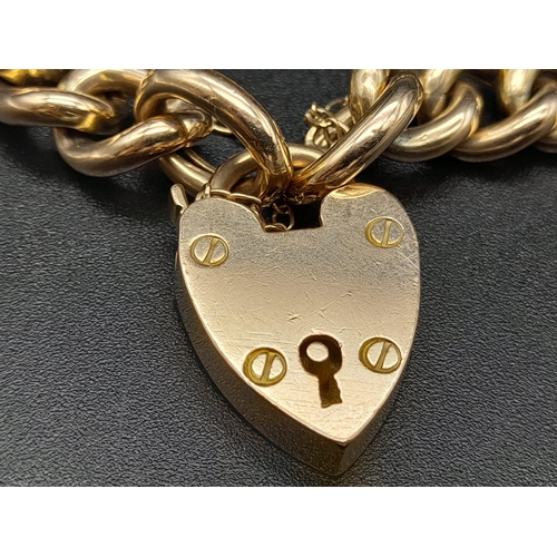 104 - A 9K Yellow Gold Curb-Link Bracelet with a Heart Clasp.
16cm. 18.77g. Ref - 531.