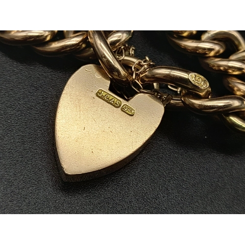 104 - A 9K Yellow Gold Curb-Link Bracelet with a Heart Clasp.
16cm. 18.77g. Ref - 531.