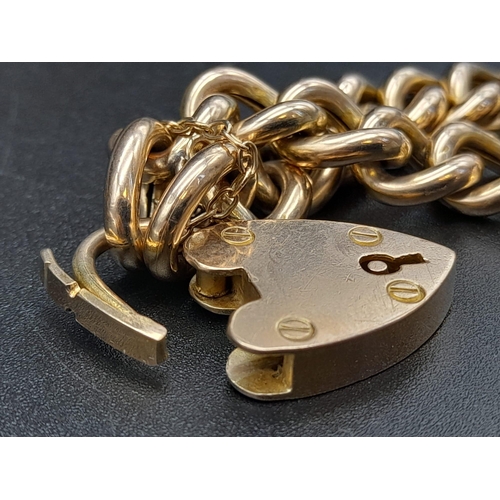 104 - A 9K Yellow Gold Curb-Link Bracelet with a Heart Clasp.
16cm. 18.77g. Ref - 531.