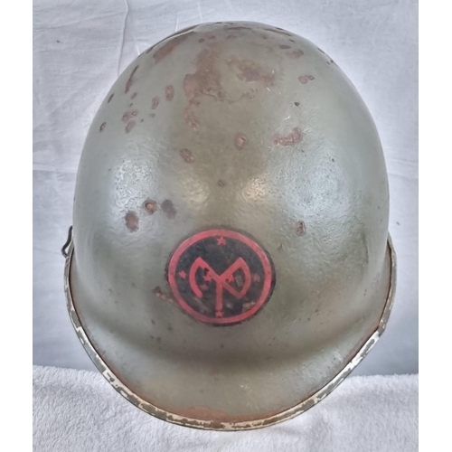 133 - WW2 US M1 Swivel Bale Helmet Front Seam Helmet with insignia of the 27th Infantry Division.