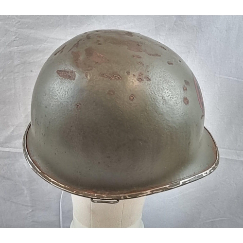 133 - WW2 US M1 Swivel Bale Helmet Front Seam Helmet with insignia of the 27th Infantry Division.