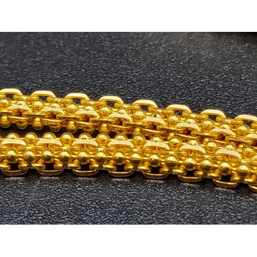 162 - A 22K Yellow Gold Intricate Ball and Belcher Link Chain.
52cm. 18.52g. Ref - 9060. A/F.