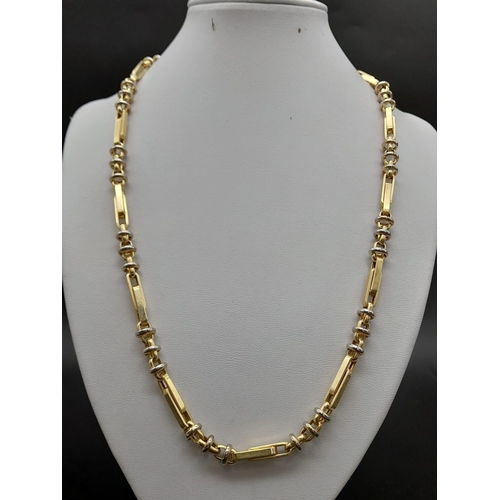 183 - A 14K Yellow Gold Intricately Linked Chain. Double bars and belcher links give this piece a unique i... 