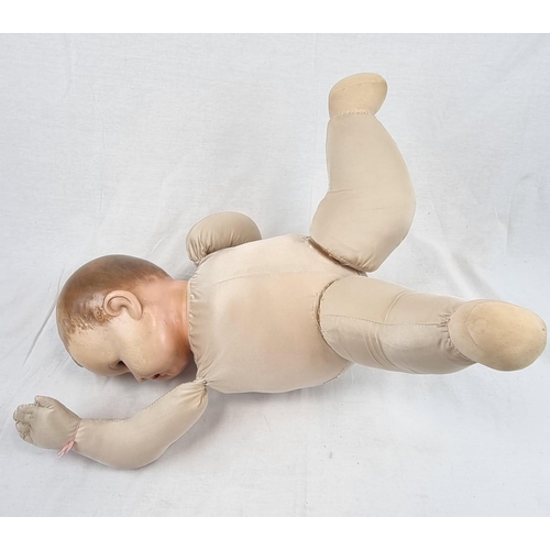 389 - An Original Vintage Possibly Antique German Baby Doll. It has flighty eyes that seem to follow you a... 