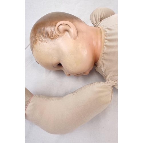 389 - An Original Vintage Possibly Antique German Baby Doll. It has flighty eyes that seem to follow you a... 