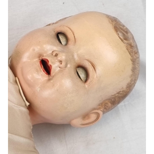 389 - An Original Vintage Possibly Antique German Baby Doll. It has flighty eyes that seem to follow you a... 