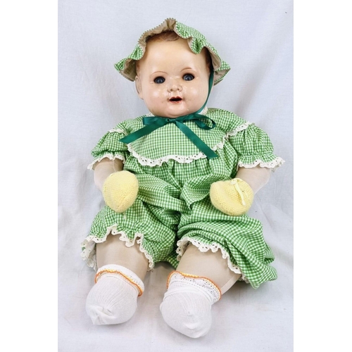 389 - An Original Vintage Possibly Antique German Baby Doll. It has flighty eyes that seem to follow you a... 